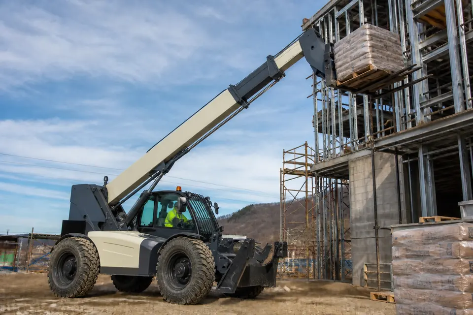 Telescopic handler placing palletized material